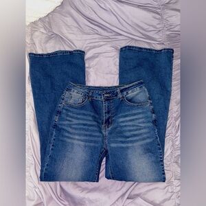 Mid-waisted flared dark blue jeans with a 34" waist and 36" length